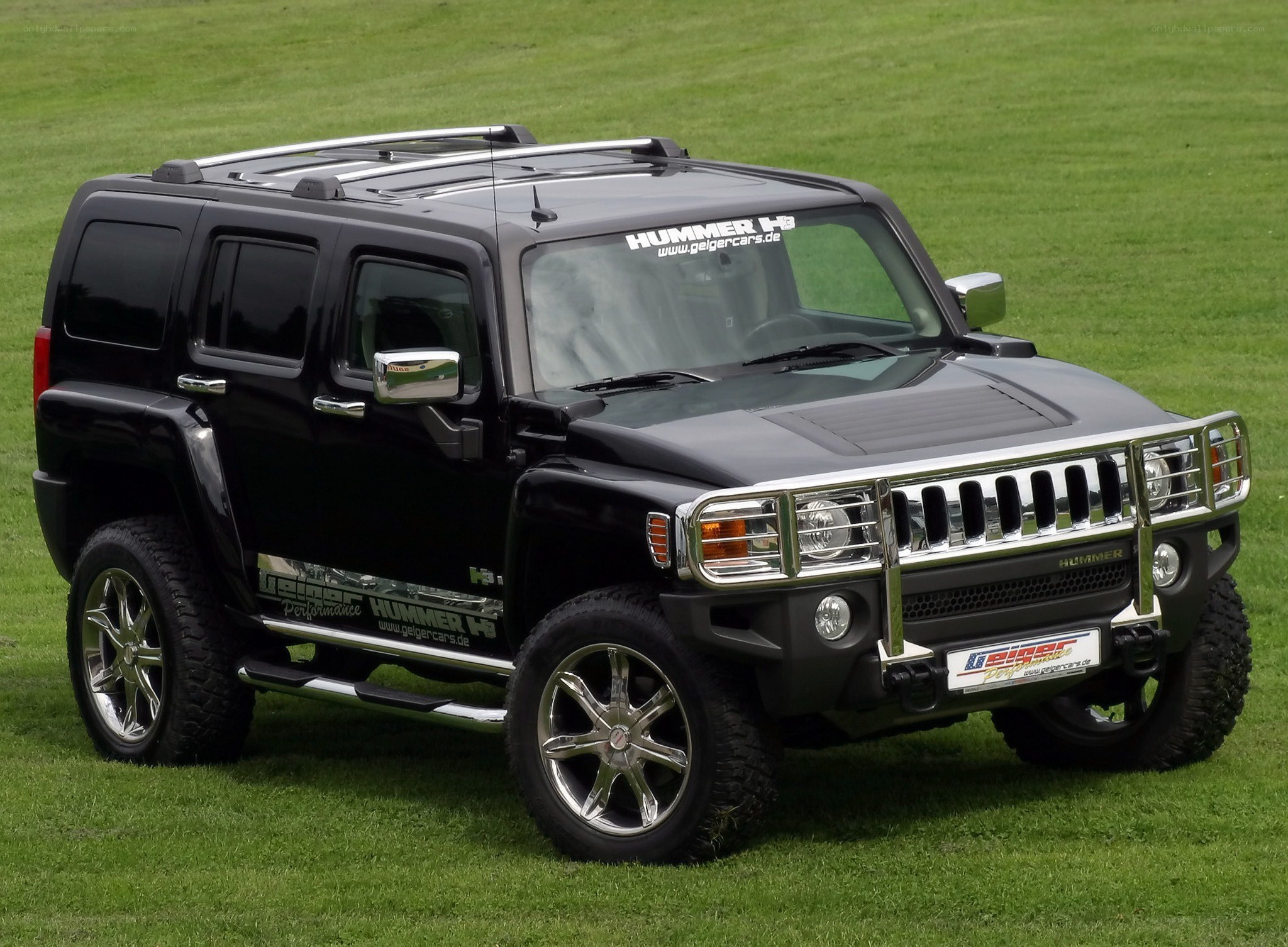 Black Hummer H3 on grass