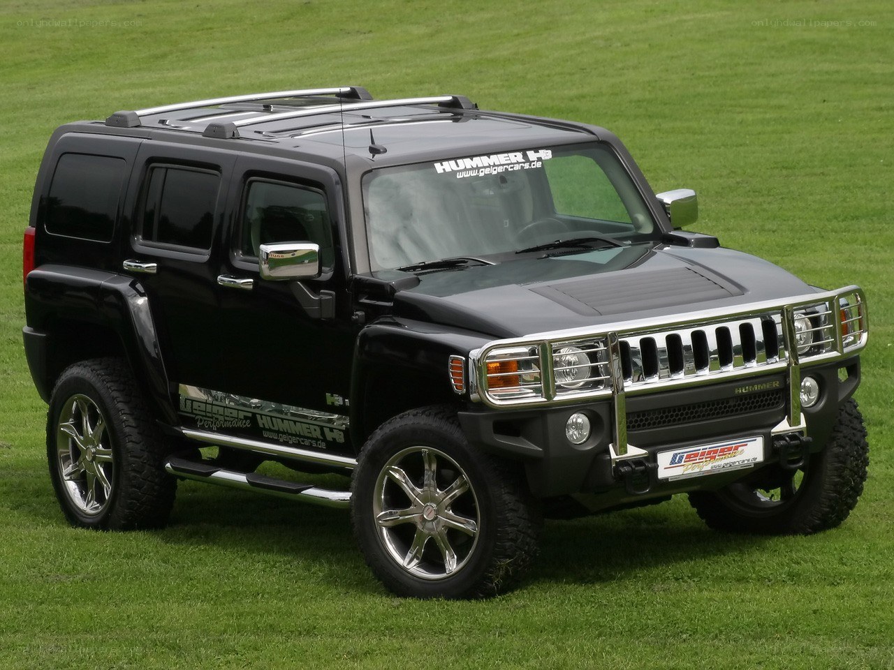 Black Hummer H3 on grass