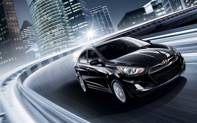 Black Hyundai on city road