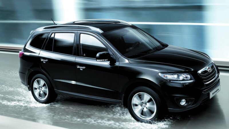 Black Hyundai Santa Fe driving