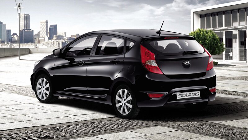 Black Hyundai Solaris hatchback