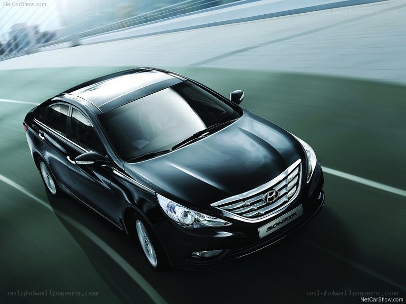 Black Hyundai Sonata in motion