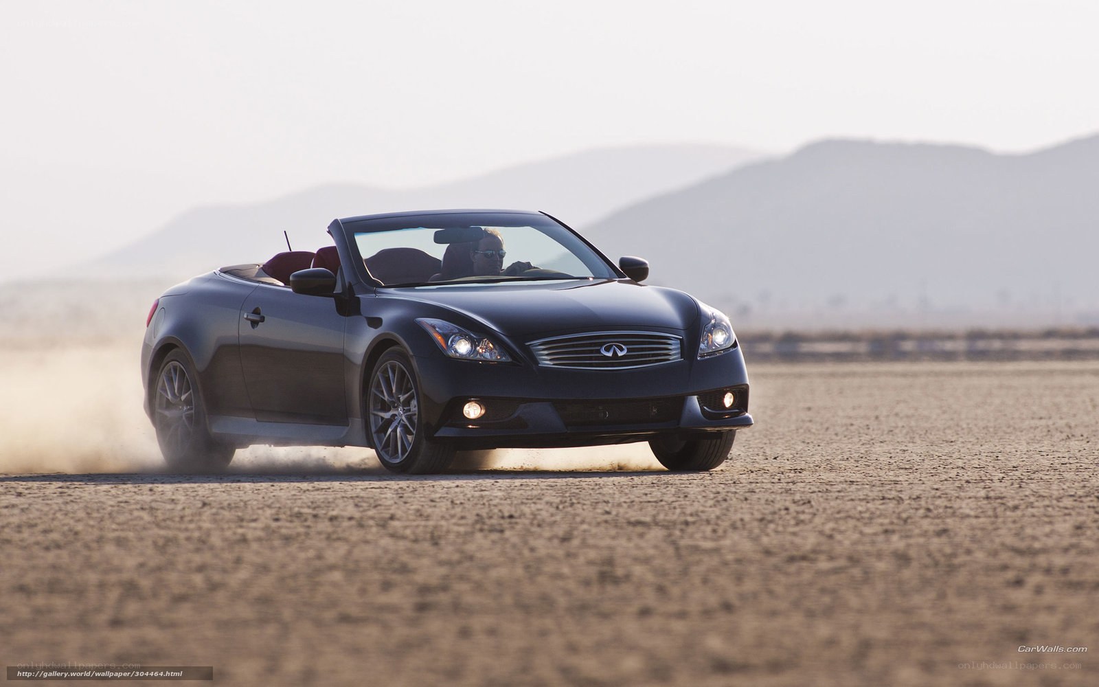 Black Infiniti convertible on desert road
