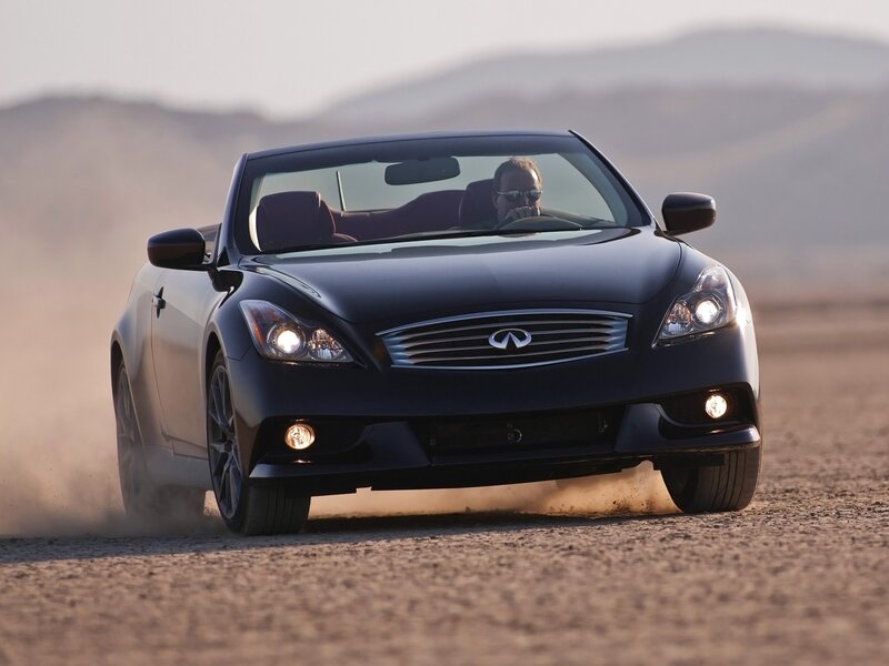 black infiniti convertible on dirt road