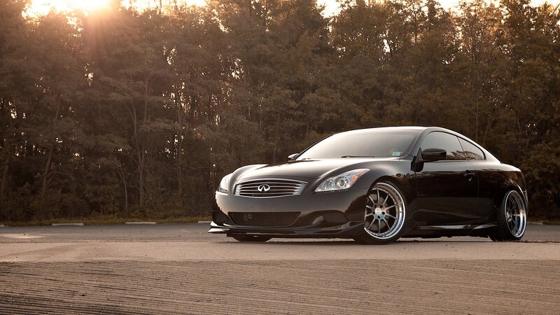 black infiniti coupe at sunset