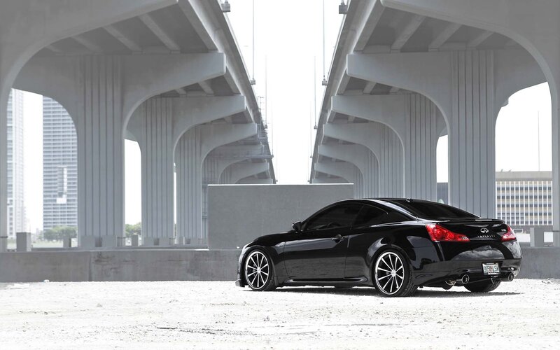 Black Infiniti coupe under bridge