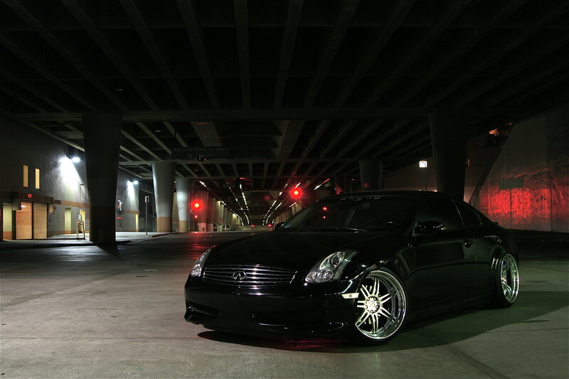 Black Infiniti G35 under overpass