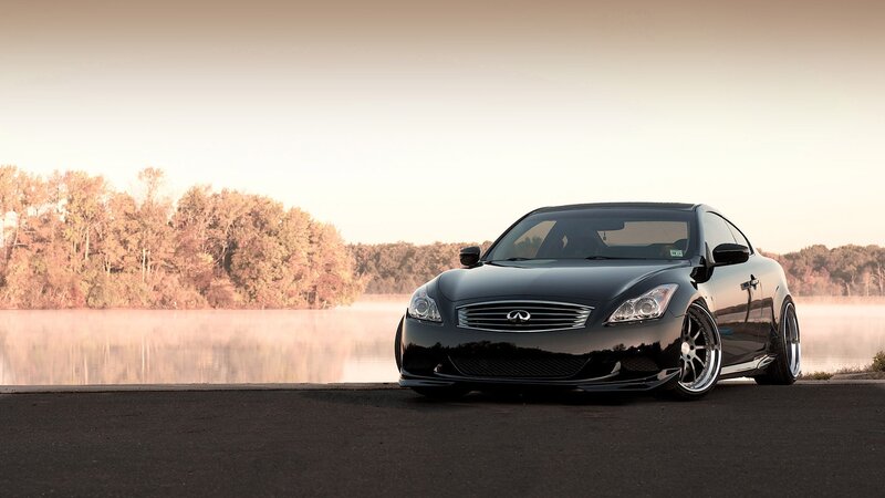 Black Infiniti G37 by a lake