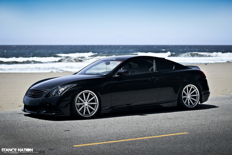Black Infiniti G37 on beach