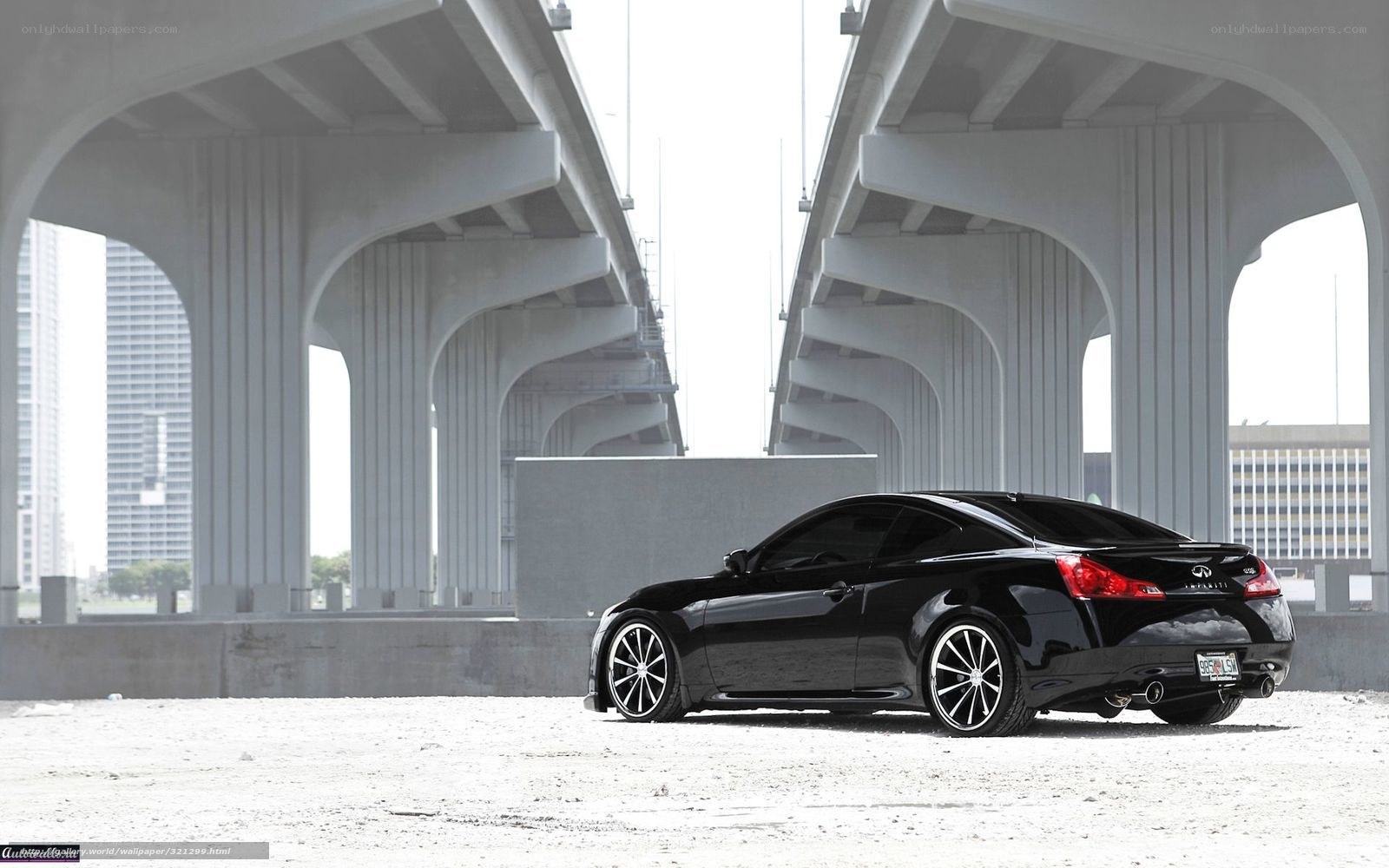 Black Infiniti G37 under bridge