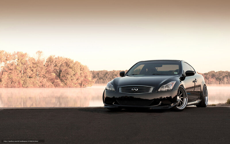 Black Infiniti on a lakeside road