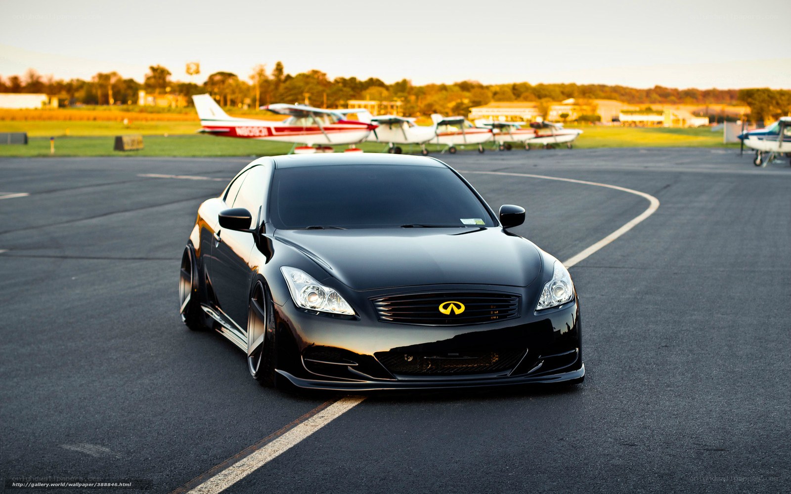 Black Infiniti on airfield