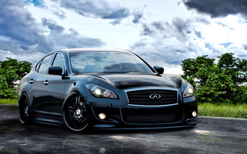 black infiniti sedan on road