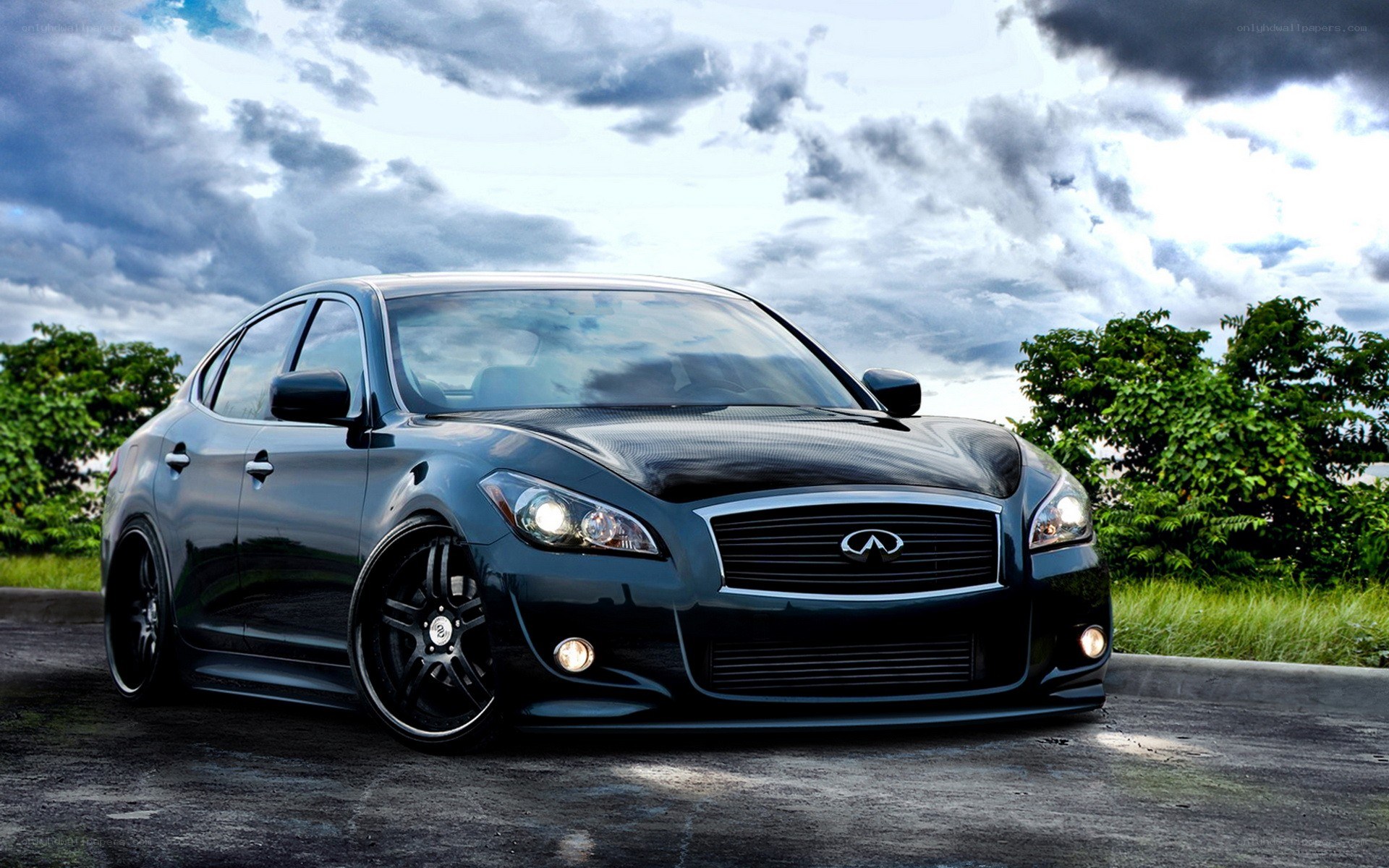 black infiniti sedan on road