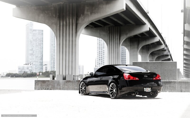 Black Infiniti under a bridge