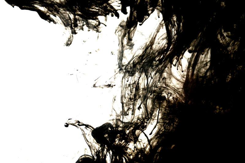 black ink dispersing in water