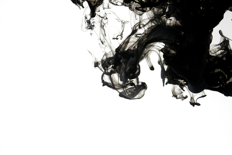 black ink dispersing in water