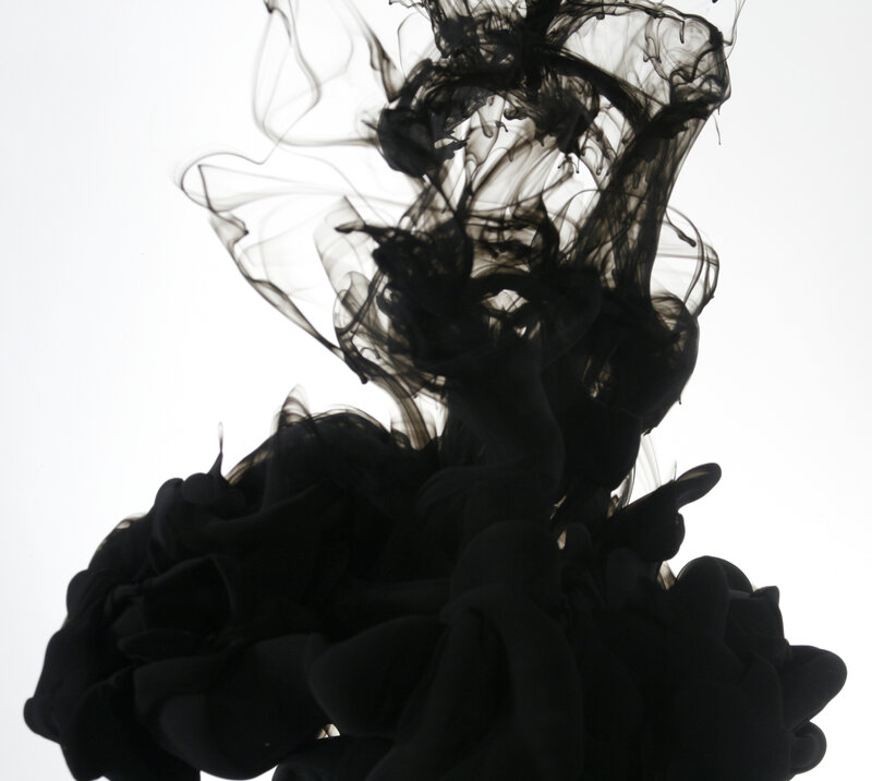 black ink dispersing in water