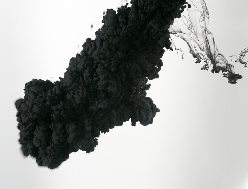 black ink dispersing in water