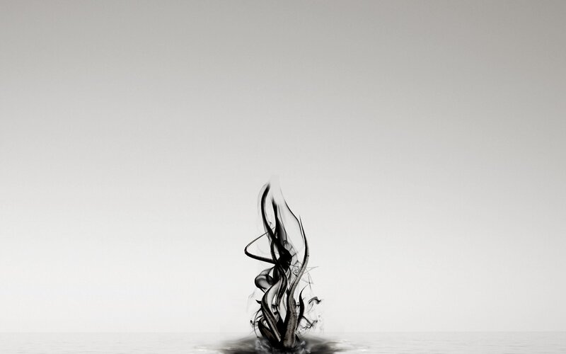 black ink rising from water