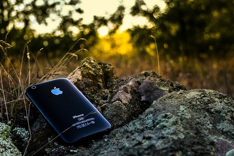 Black IPhone on Rock