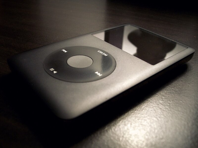 Black iPod on dark surface