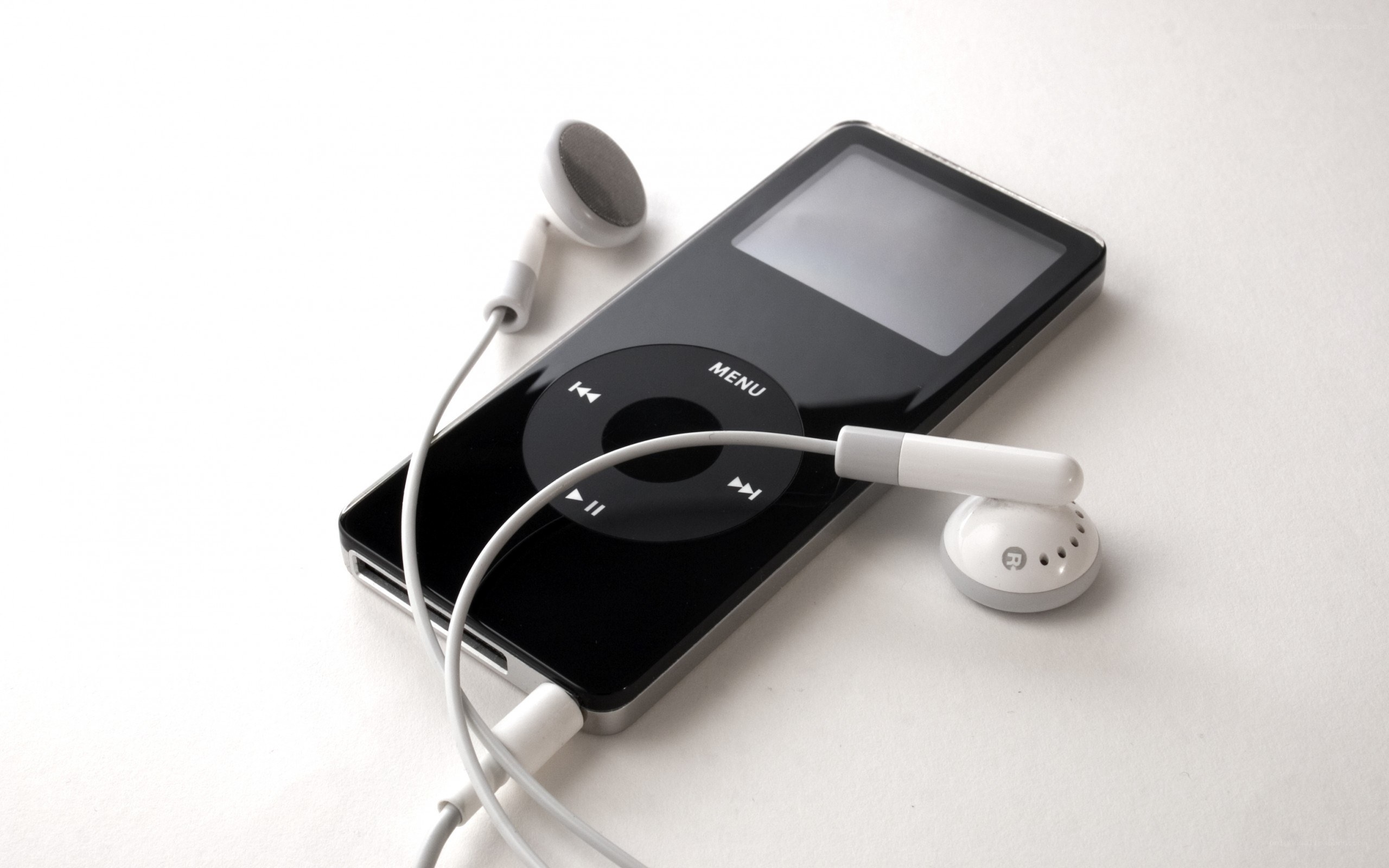 Black iPod with white earbuds