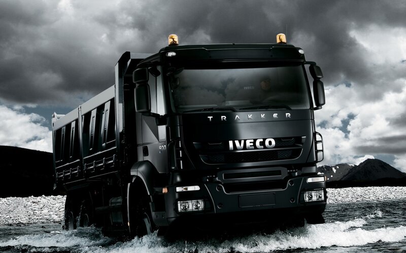 Black Iveco truck in water