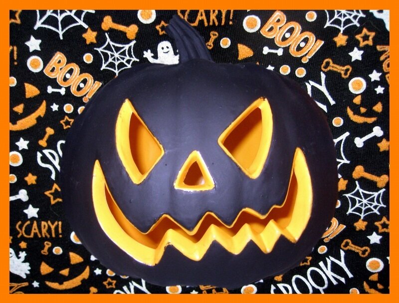 black jack-o-lantern on Halloween fabric