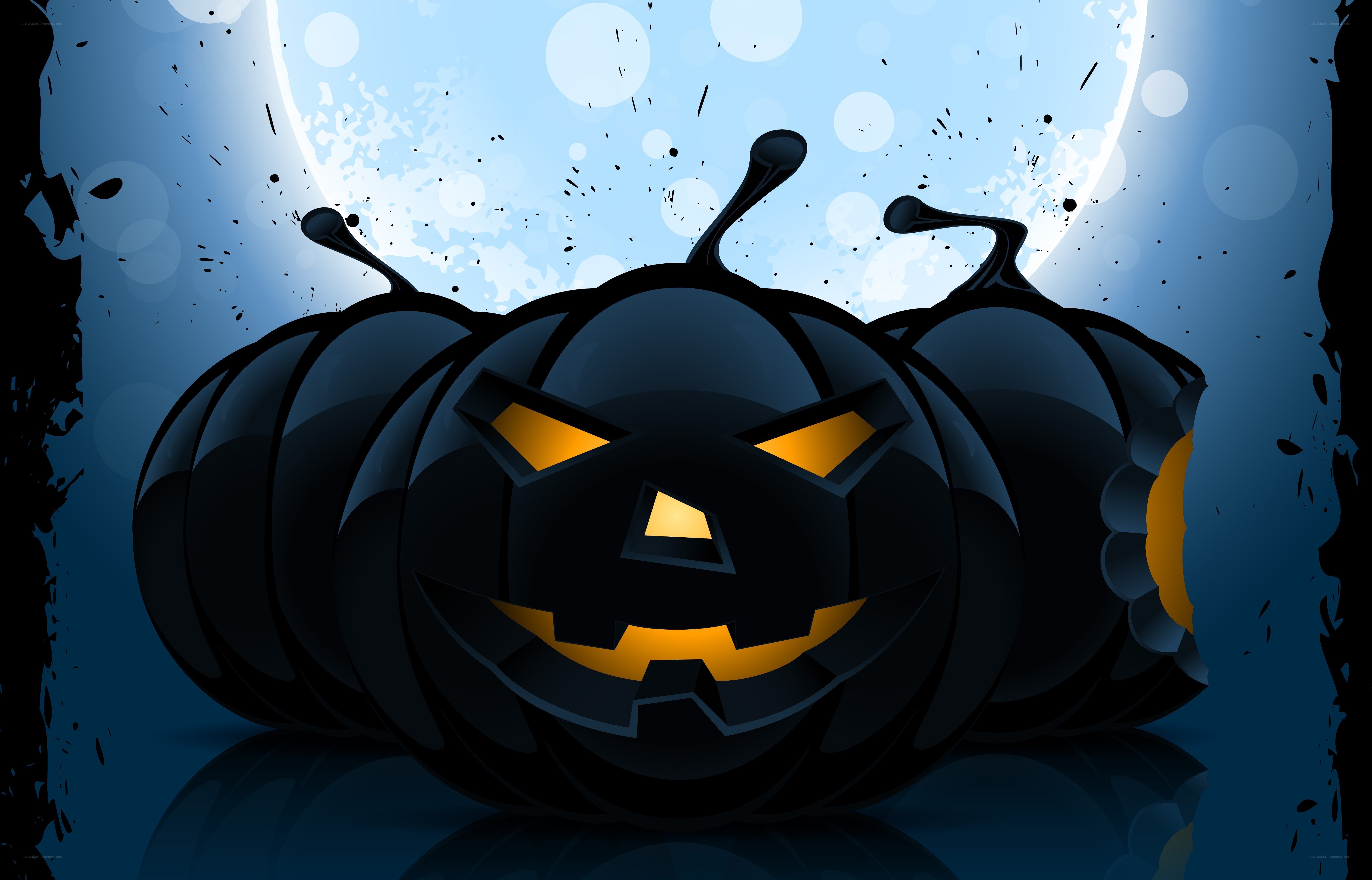 Black jack-o'-lantern under moon