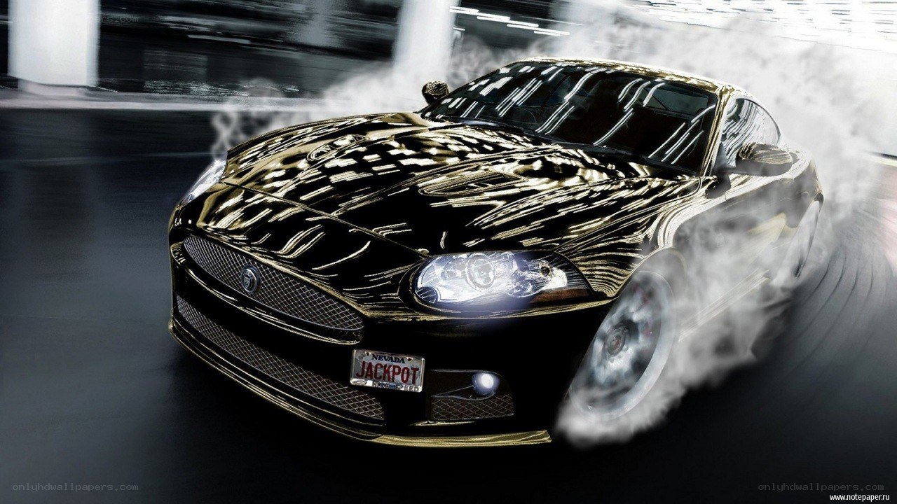 black jaguar car drifting