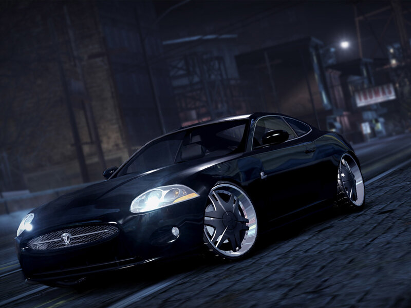 black jaguar coupe at night