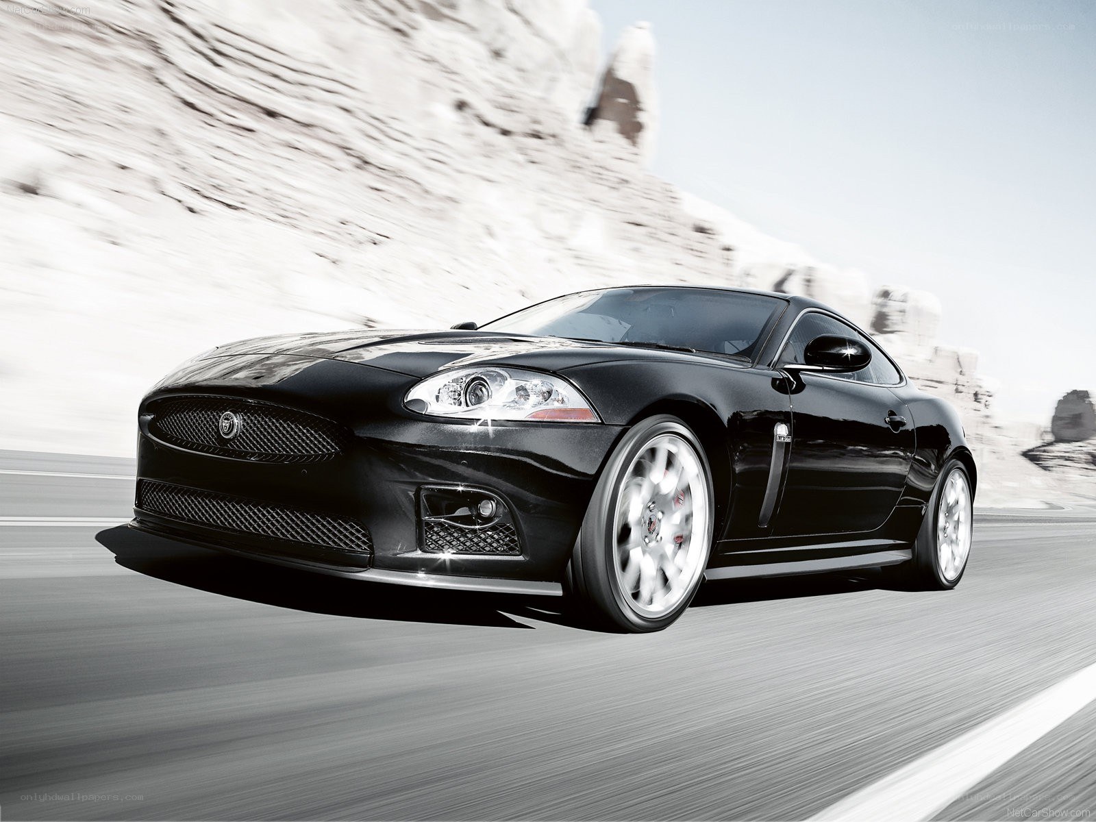 black jaguar coupe on road