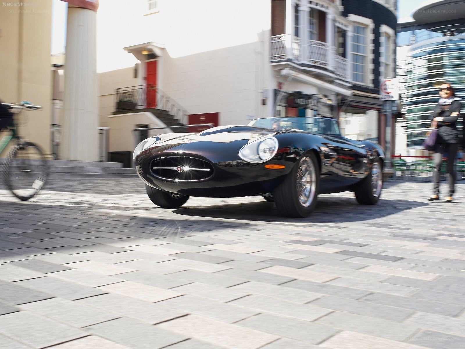 Black Jaguar E-Type on city street