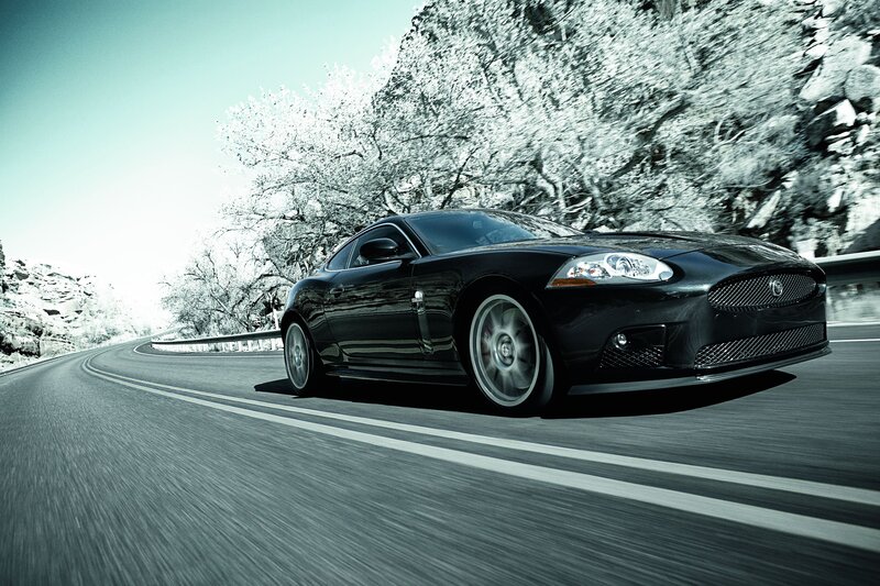 Black Jaguar on a winding road