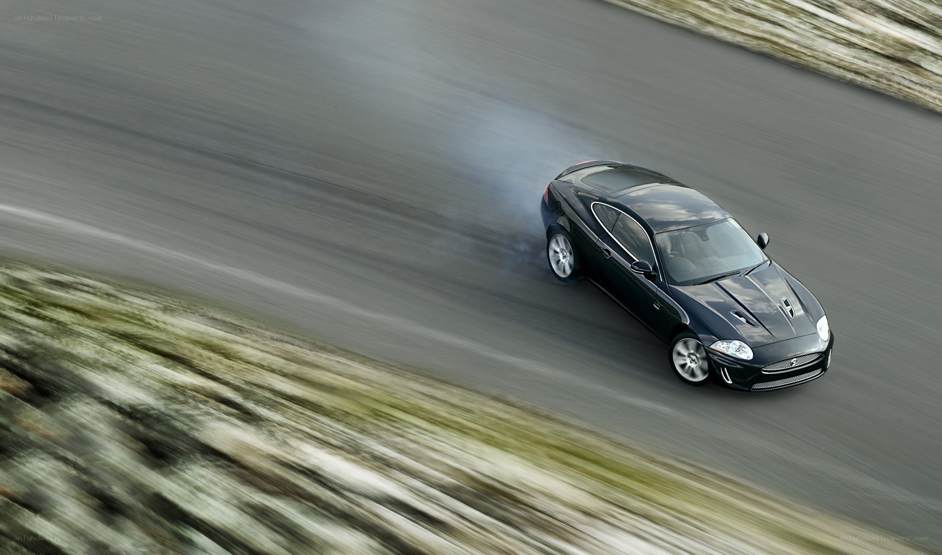 black jaguar speeding on road