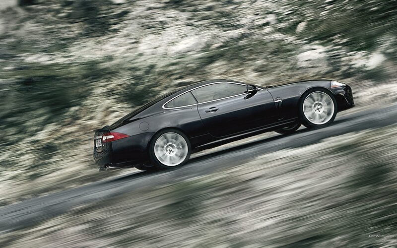 black jaguar speeding on road