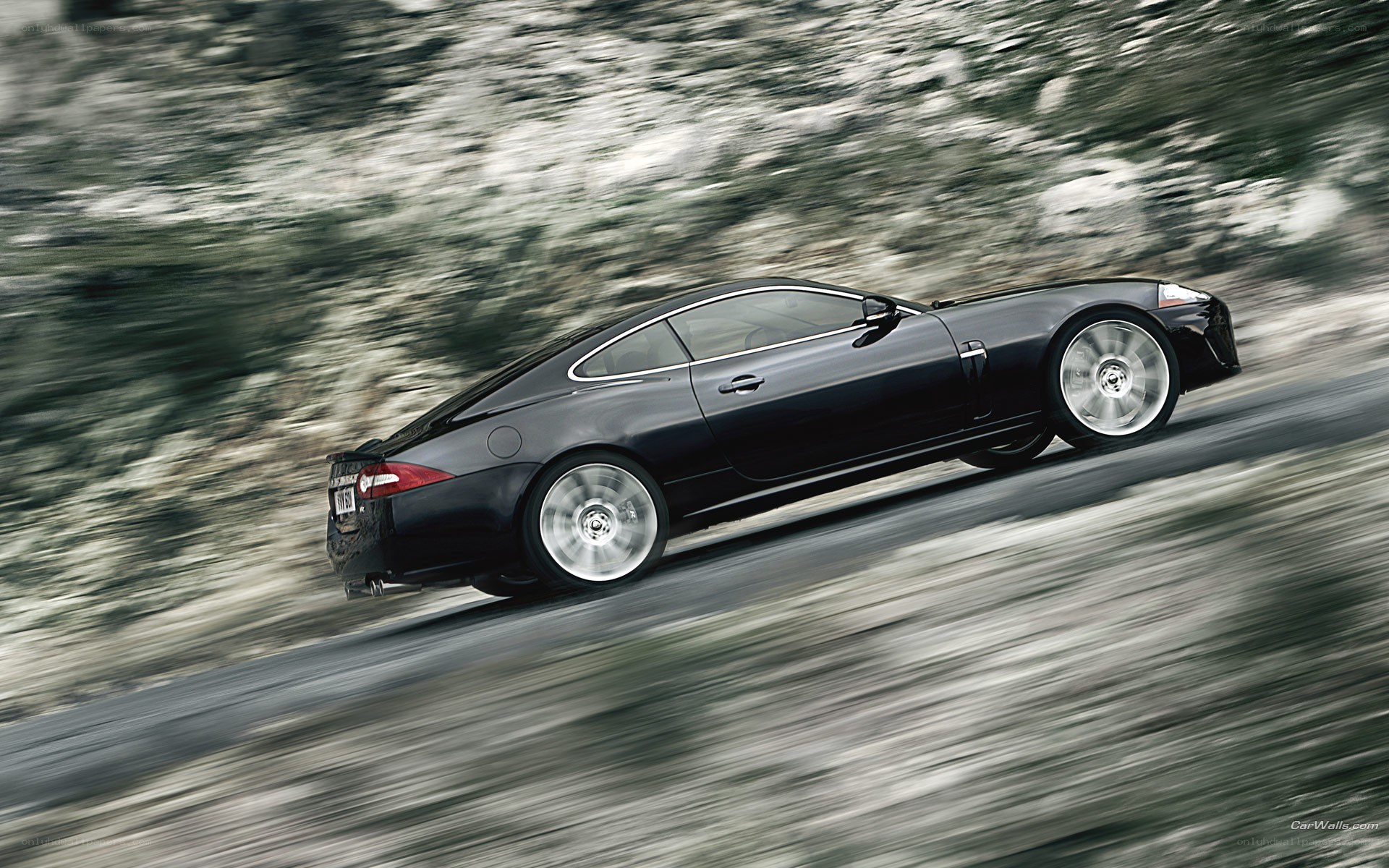 black jaguar speeding on road