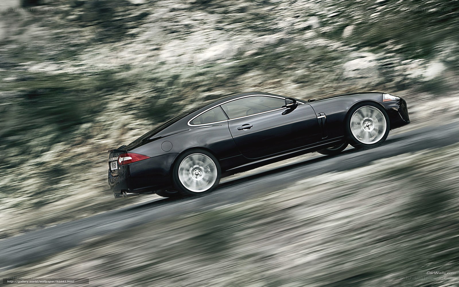black jaguar speeding on road