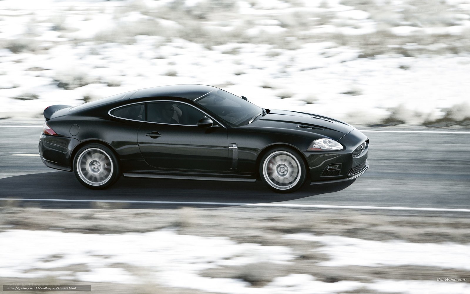 Black Jaguar sports car in motion