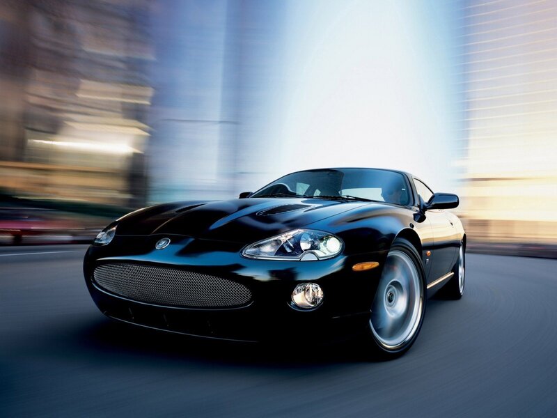 Black Jaguar sports car in motion