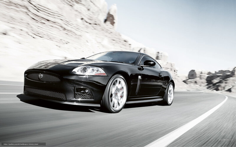Black Jaguar sports car on road