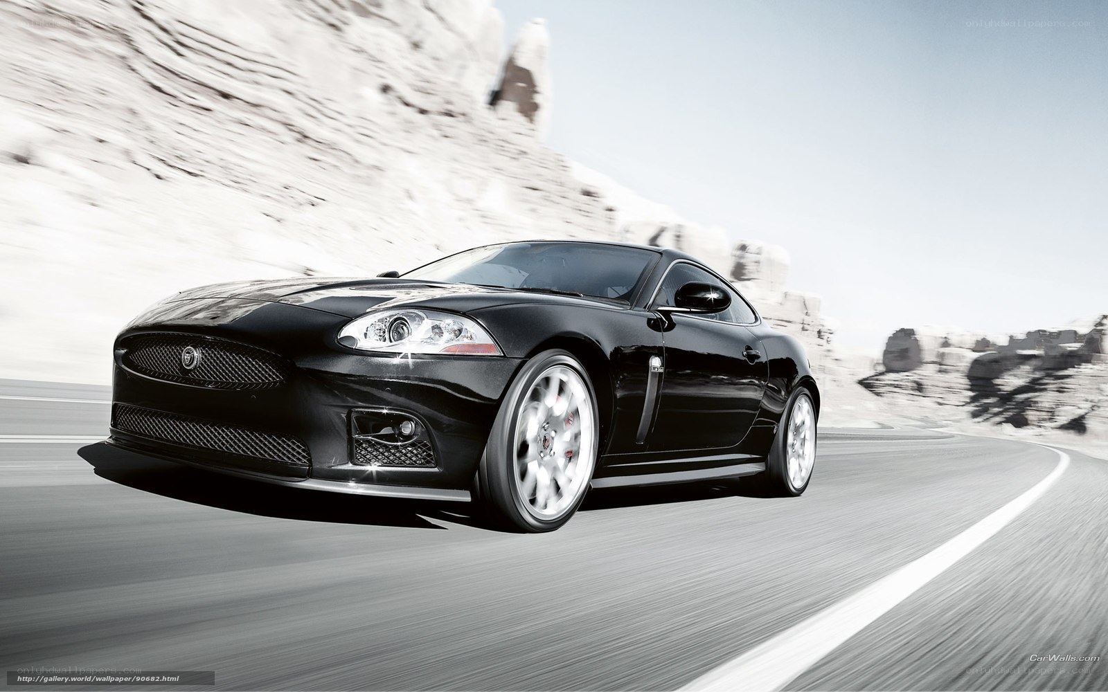 Black Jaguar sports car on road