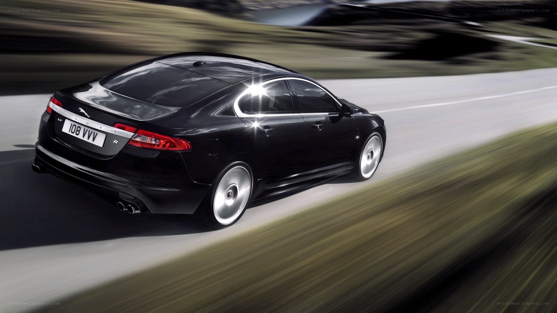 Black Jaguar XF in motion