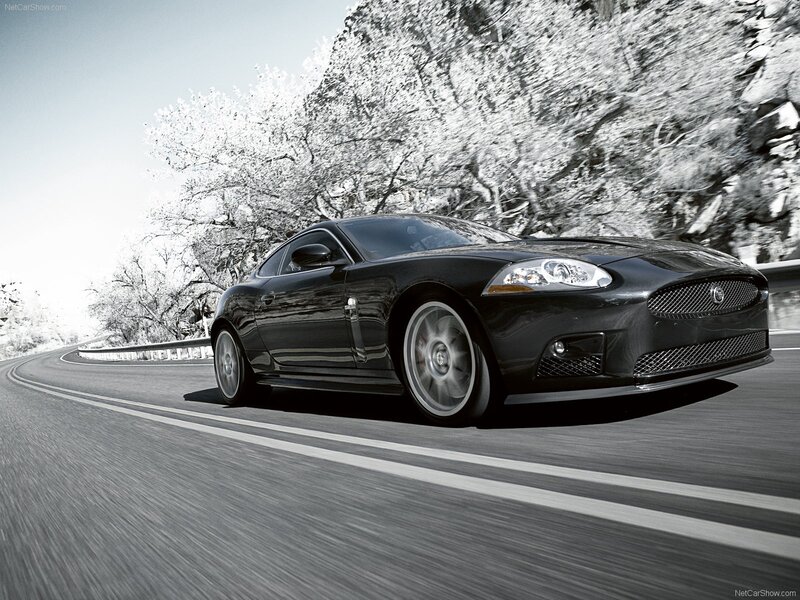Black Jaguar XK on a winding road