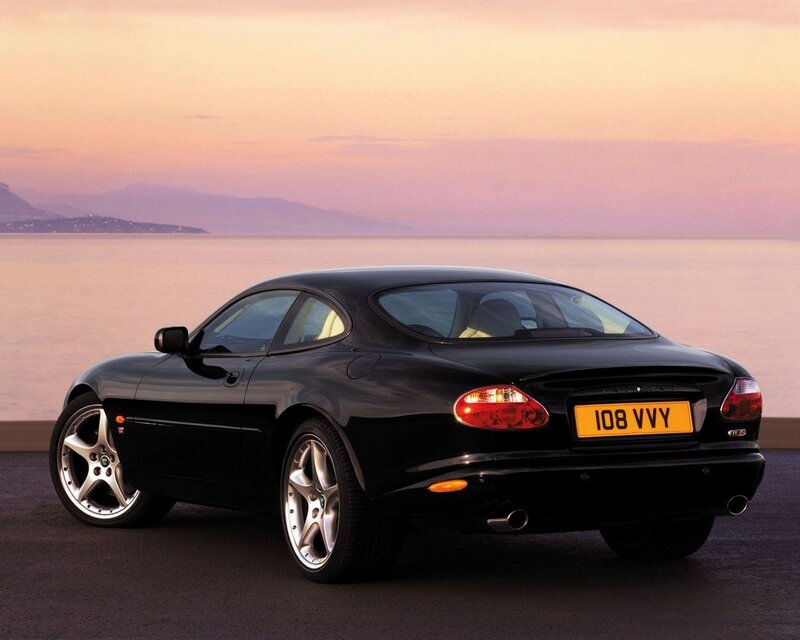 Black Jaguar XKR by the sea