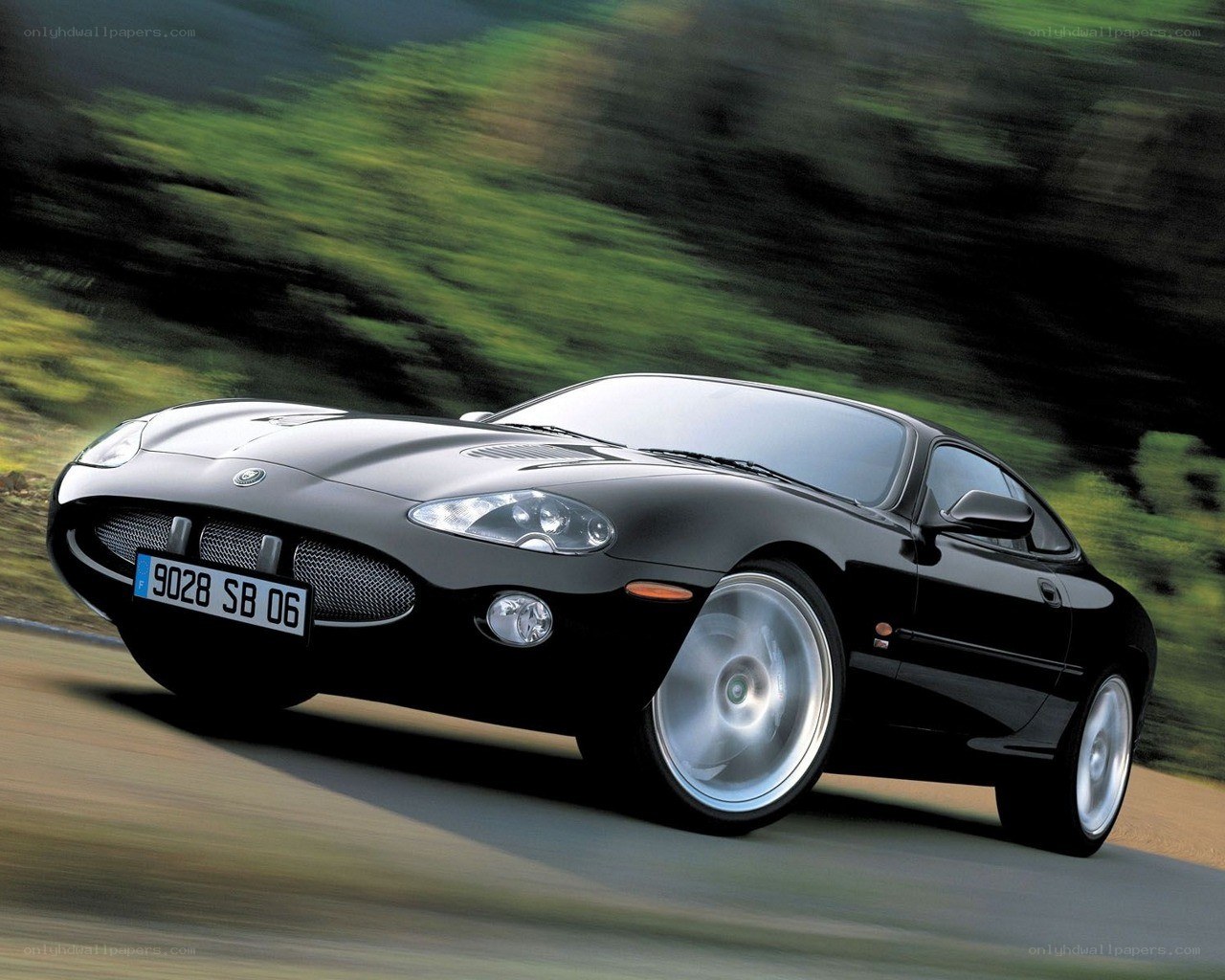 Black Jaguar XKR in motion