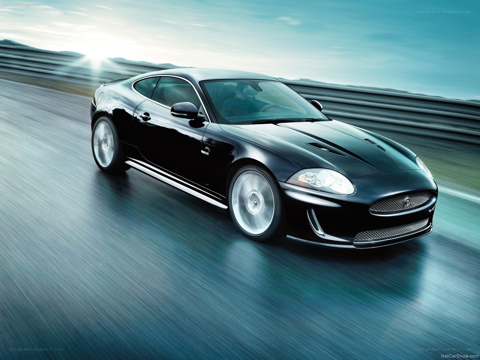 Black Jaguar XKR in motion