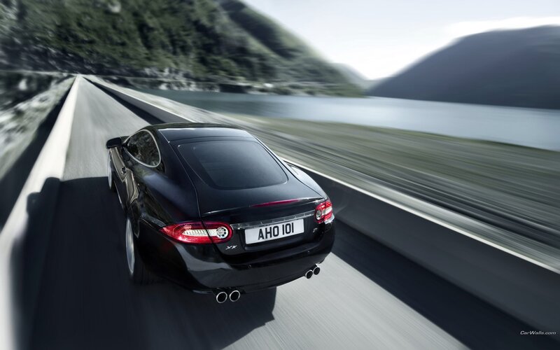 Black Jaguar XKR on a scenic road