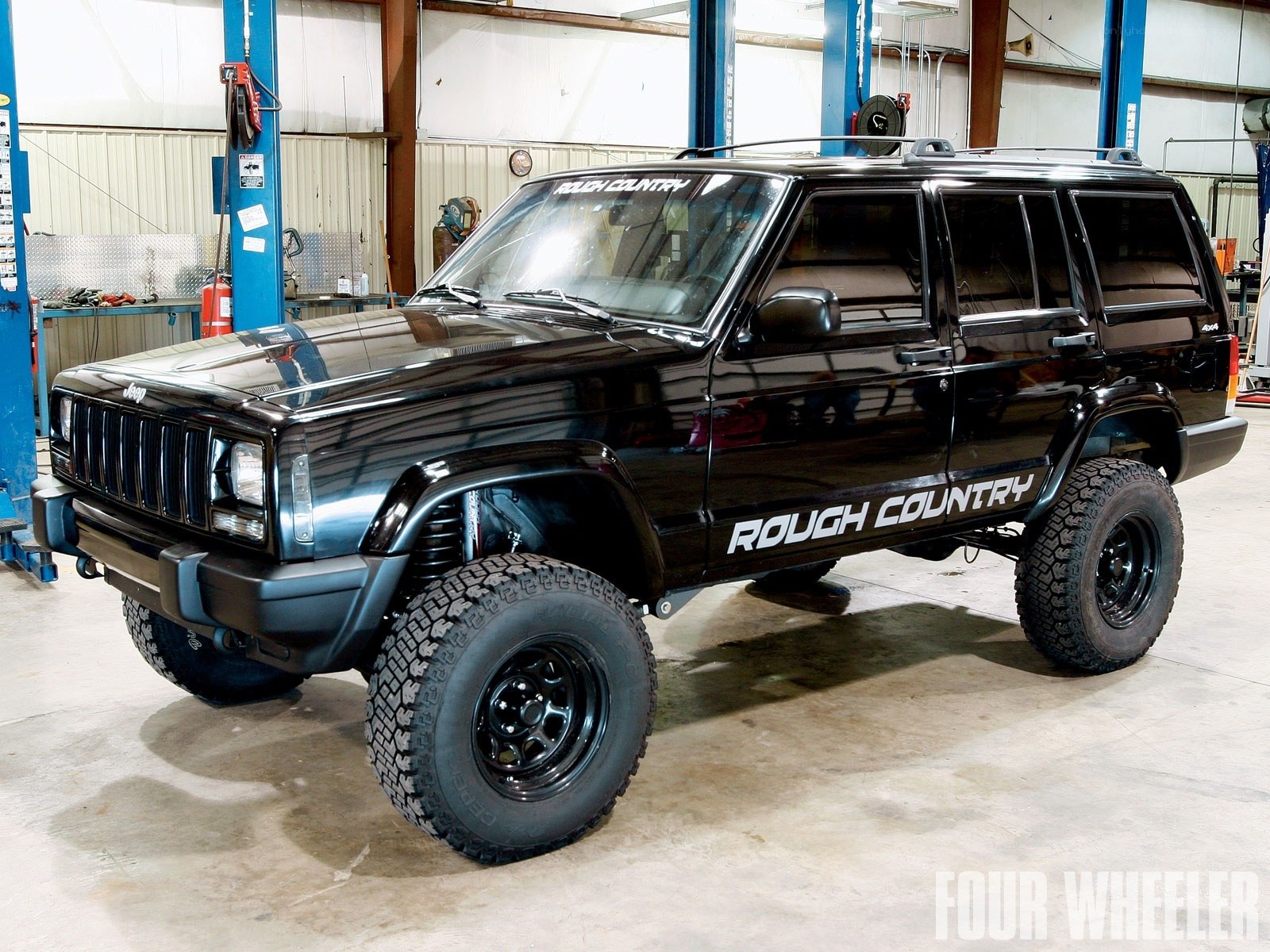 Black Jeep Cherokee in garage